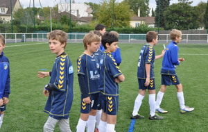 Bilal vient d' annoncer la compo des deux équipes . On lit de la déception ou de la frustration chez les joueurs de l ' équipe 2... avant  une splendide réaction .  